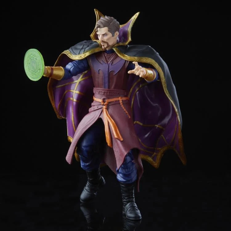 Action figure of a character in a purple and blue costume with a cape, holding a green disc.