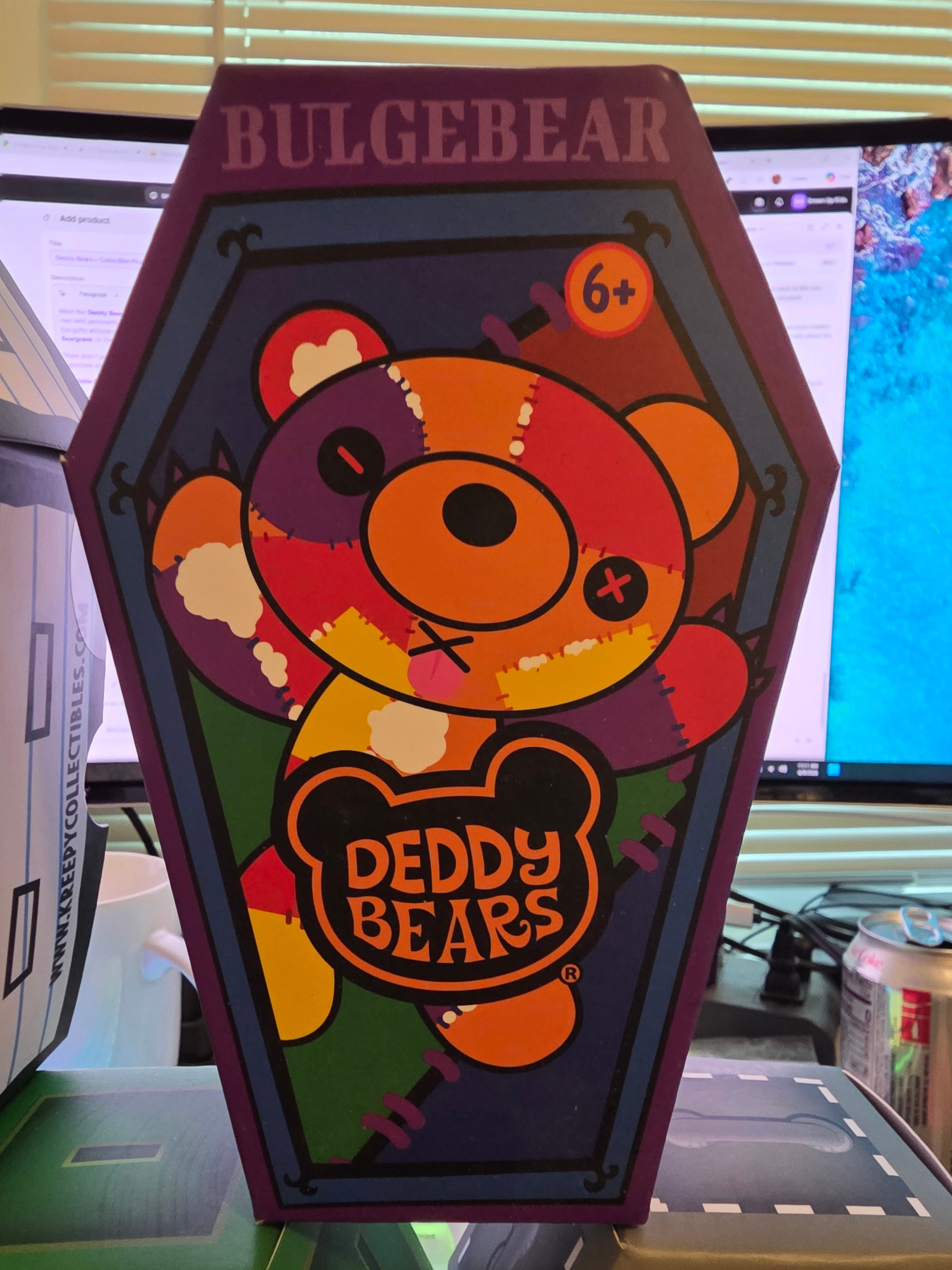 Colorful Deddy bear-shaped sign with 'Bulgebear' branding on a blurred indoor background