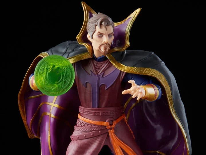 Figurine of a character in a purple outfit with a green orb, on a black background