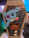 Cartoon bear design on a product packaging with 'Skidmark' and 'Deddy Bears' branding.