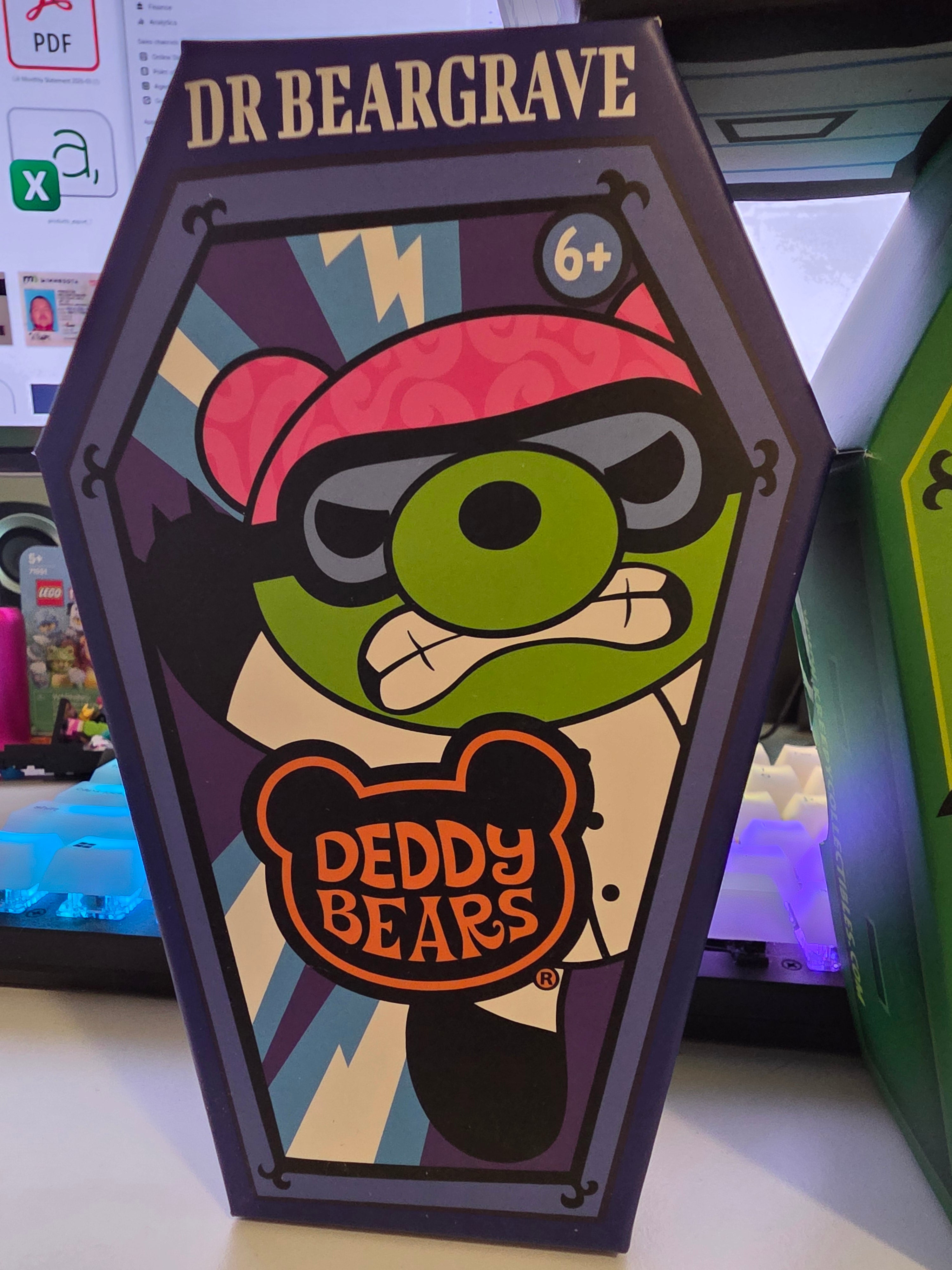 Cardboard box with cartoon character and 'Dr Beargrave' branding on a desk.